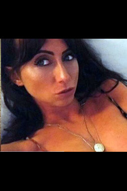 sydney female stripper wearing small blue bikini on front cover of magazine