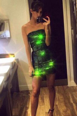 sexy dark haired bucks party hostess wearing sparkley green dress in sydney city